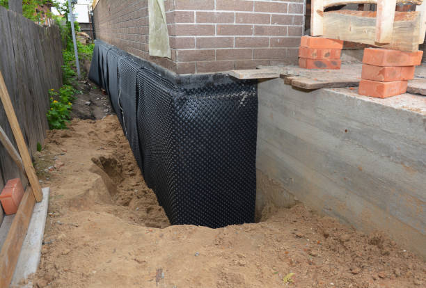 SJ Waterproofing Pros technician performing targeted Waterproofing assessment in Kipton, OH